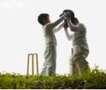 Boys playing cricket