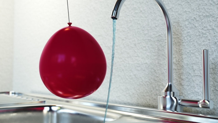 charged balloon by water tap