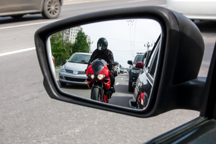 wing mirror with motorbike in it